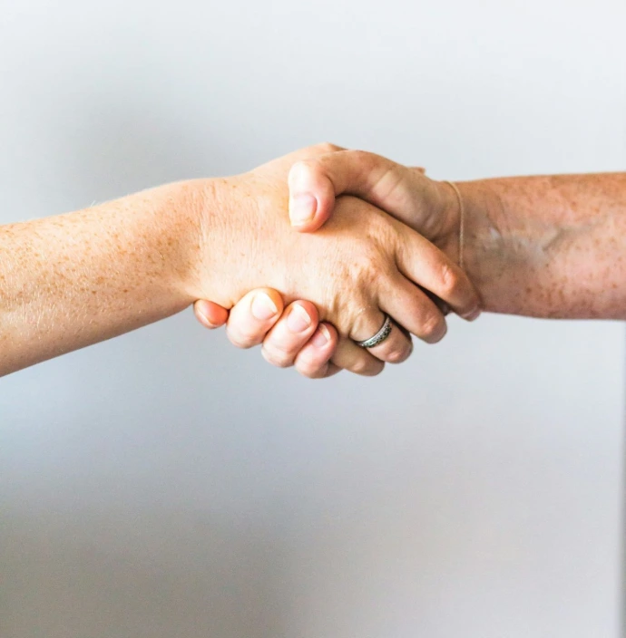 person holding hands of another person